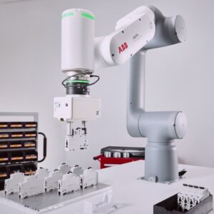 ABB GoFa cobot assembling a piece of electronics.