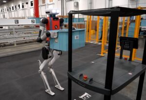 The Digit humanoid carries totes at a Spanx warehouse in Georgia.