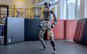 new electric Atlas humanoid from Boston Dynamics doing pushups.