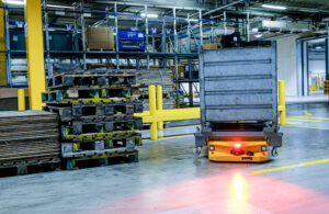 continental AMR carries totes through manufacturing plant.