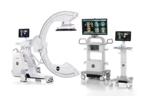 GE HealthCare offers its OEC 3D Imaging System, which is made up of three carts with monitors, and one cart with a large, C shaped device.