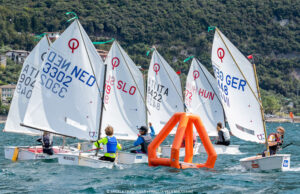 Sailboats go around a robotic buoy used in the 2024 Paris Olympics.