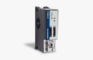 An image of the new Kollmorgen PCMM2G controller, which looks like a grey rectangular box standing on its side, with a blue strip on the face and various outlets.