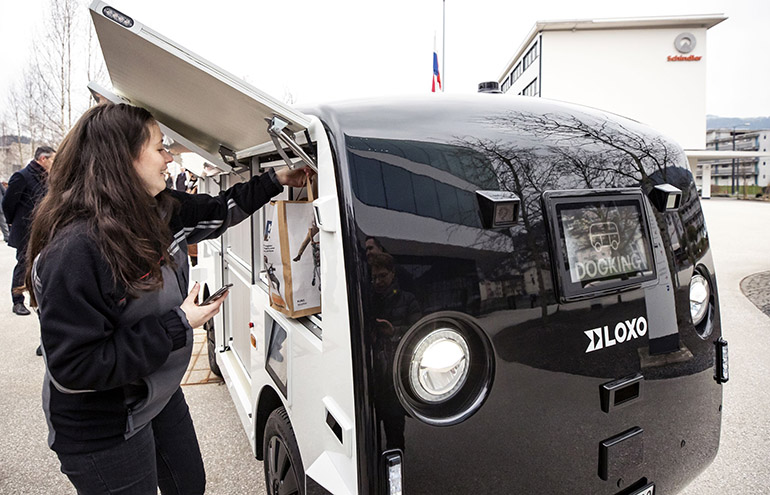 The LOXO Alpha autonomous vehicle makes a delivery.