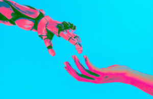 Northewestern proviced an image of robotic arm reaching out to a human arm on a blue background.