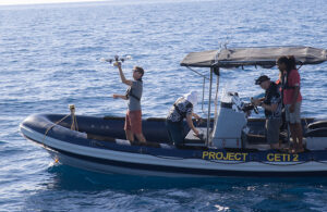 Project CETI boat with people interacting with drones.